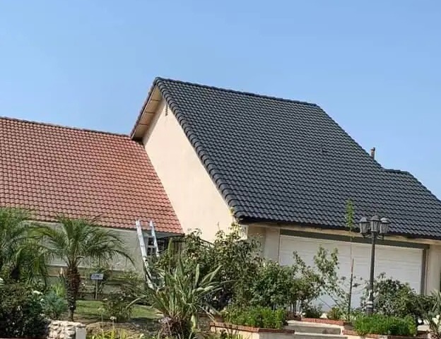 Dark gray tile roof on a single-story house